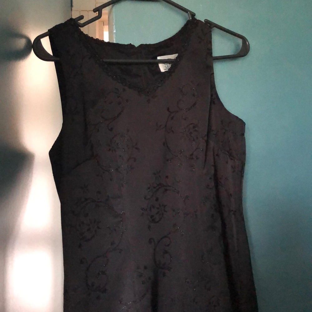 Classic little black dress with beaded designs.